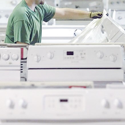 Appliance technician at work